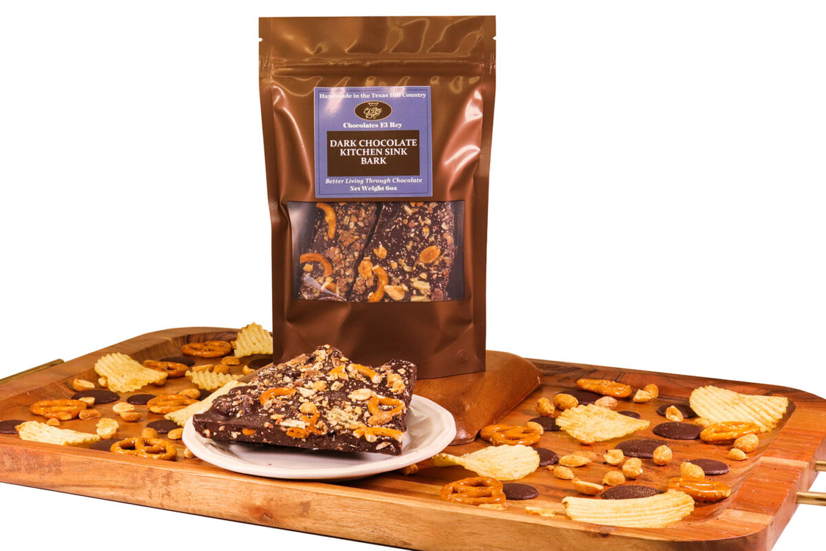 Dark chocolate bark loaded with salty sweet snack foods like pretzels and potato chips